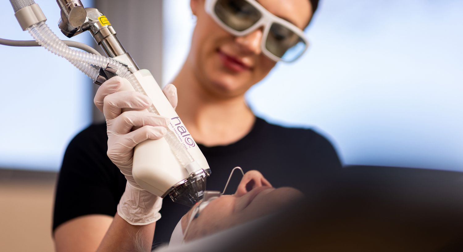 Laser treatment session in a skincare clinic.